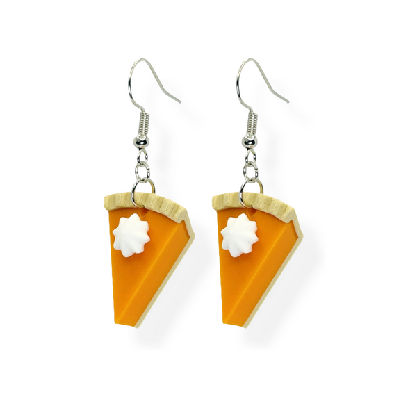 Pair of pumpkin pie slice dangle earrings with sculpted whipped cream topping.