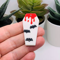 White Vampire Coffin with Blood and Bats Acrylic Charm, 45x22mm