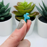 24 Turquoise colored Howlite Cross Beads